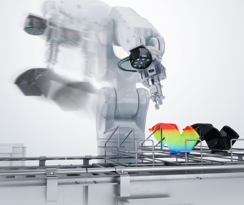 A robot with a CG-R camera on its wrist, caught moving above a conveyor, with a colour-coded 3D height map of a part